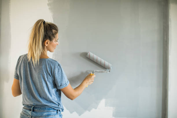 istock Woman doing diy project in apartment 1204046061