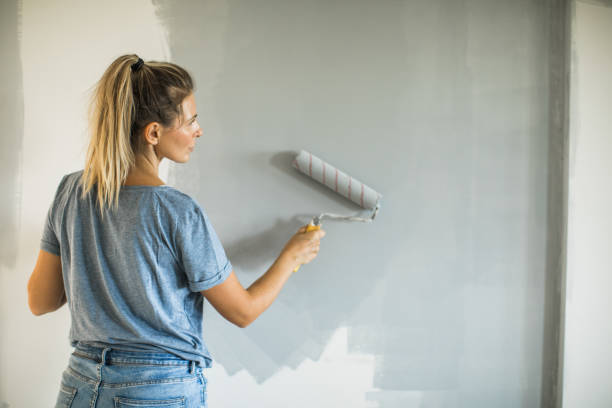istock Woman doing diy project in apartment 1204046063