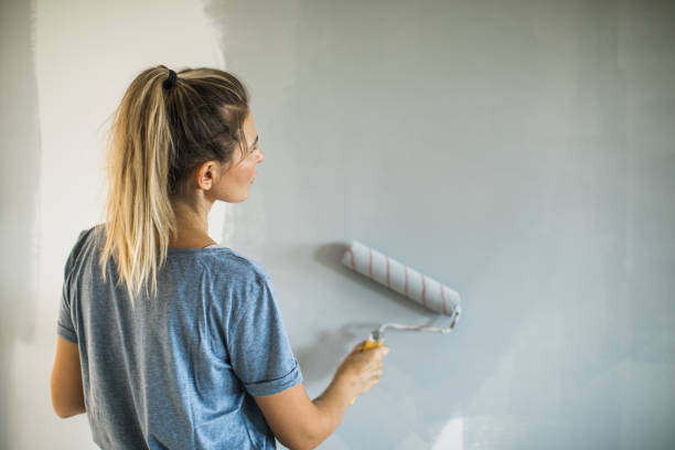 istock Woman doing diy project in apartment 1204046123