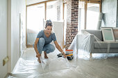 Woman doing diy project in apartment