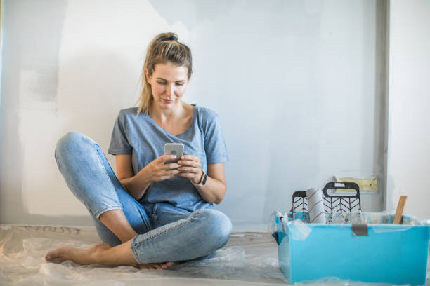 istock Woman doing diy project in apartment 1204046131