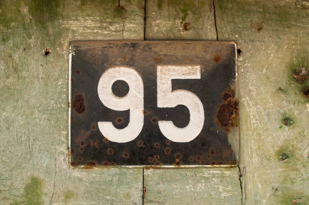 istock Weathered enameled plate number 95 1204049522
