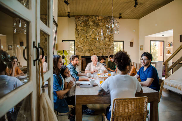 istock Family gathering at home having breakfast 1204050495
