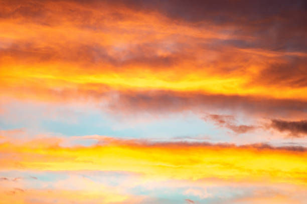 istock Red and yellow clouds in the sunset sky 1204050724