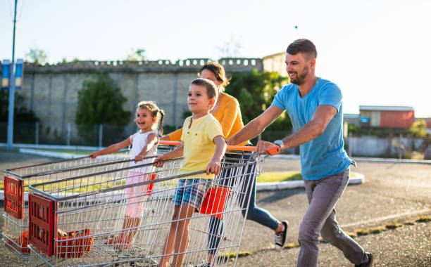 istock Family having fun after grocery shopping 1204054505