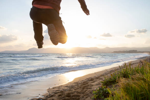 istock Young man in mid-air jump 1204055420
