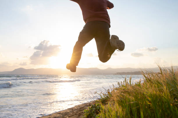 istock Young man in mid-air jump 1204055455