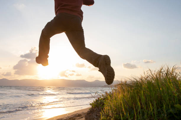 istock Young man in mid-air jump 1204055546