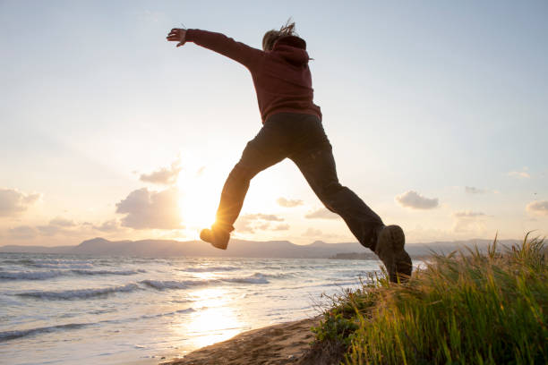 istock Young man in mid-air jump 1204055548
