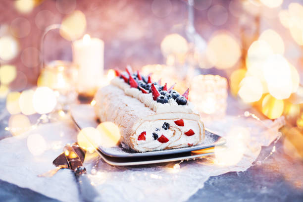 istock Meringue roll cake with cream and fresh berries 1204057003