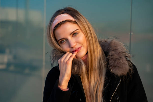istock Cute flirty young woman posing for a shot 1204057099