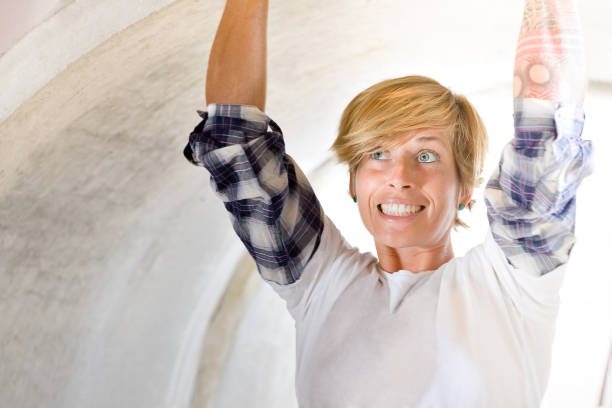istock Gold haired lady touching the inside of a pipe 1204058598