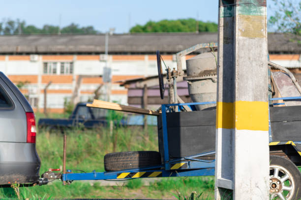 istock A concrete mixer used to make cement and concrete being transported in a blue trailer pulled by a passenger car 1204061880