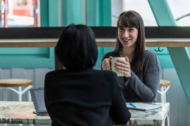 istock Two Women Business Meeting Hip Cafe 1204064496