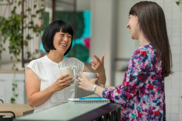 istock Two Women Business Meeting Hip Cafe 1204064752