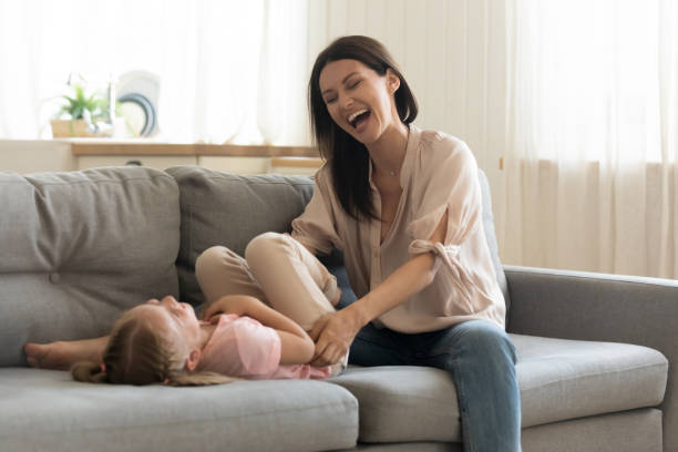 istock Happy mom and daughter have fun at home 1204066335