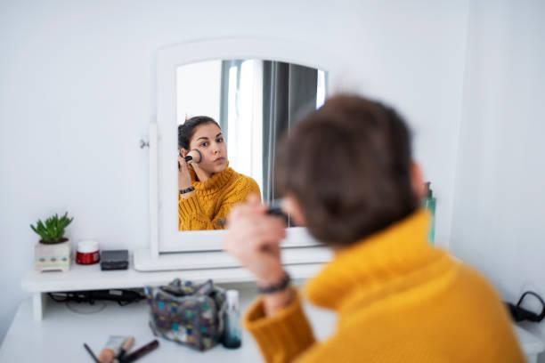 Young Latino Woman Applying Makeup