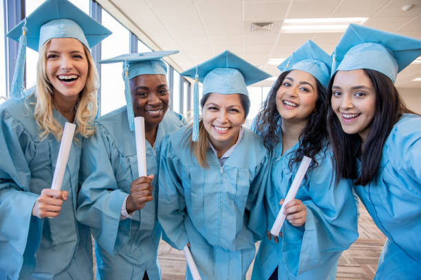 istock Group of college graduates holding diplomas 1204066568