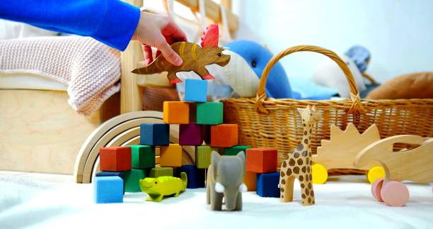 istock A hand is playing with child games 1204067699