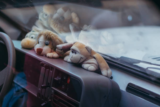 Car. Car interior with toys on the dashboard.