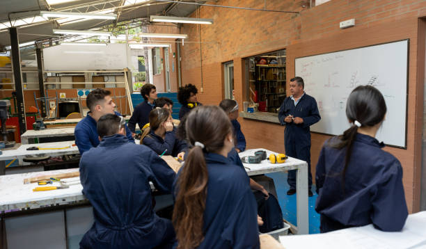 istock Teacher talking to a group of industrial design students in a class 1204069352