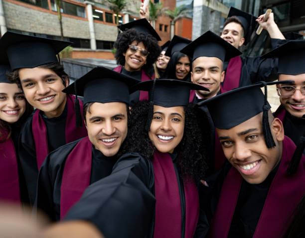 istock Group of students taking a selfie on graduation day 1204069917