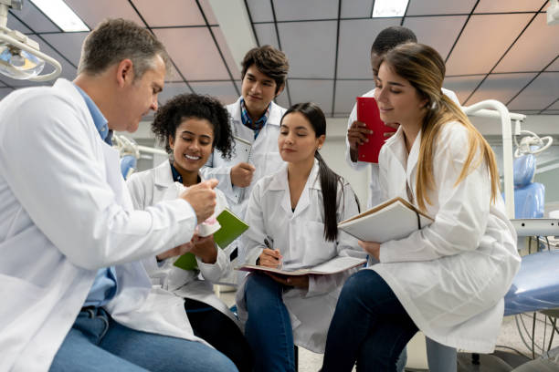 istock Group of students in class at dental school 1204070533