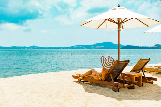 Woman in beach chair on tropical beach