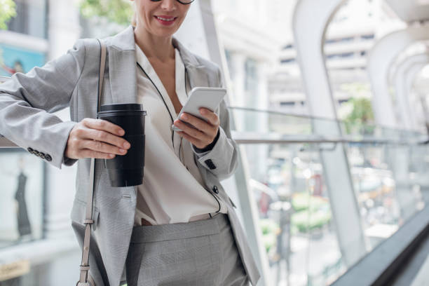 istock Businesswoman Using Her Smart Phone Outdoors 1204071018