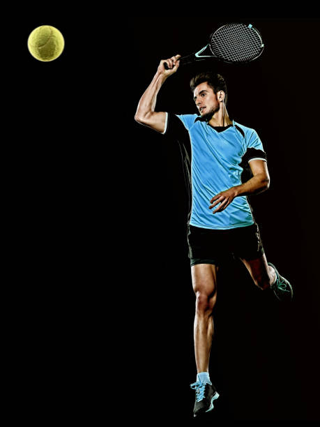 istock caucasian young tennis player man isolated black background 1204073394
