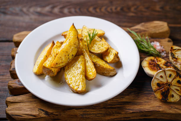 istock baked potato with spices, home cooking concept 1204073532