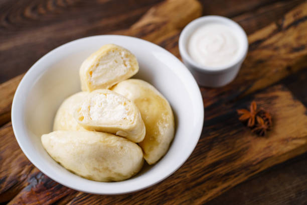 istock Cottage cheese stuffed pierogi, homemade dumplings 1204073544