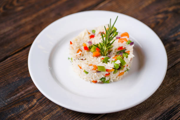 Vegetarian risotto with vegetables, delicious healthy meals, portion serving. Italian dinner. Restaurant menu food photo