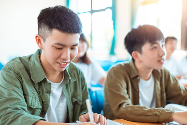 istock asian teenager Student Study with Classmate in Classroom 1204083206