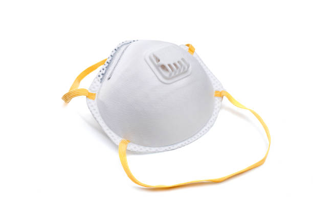 istock corona virus, air pollution mask with valve on white background 1204083238