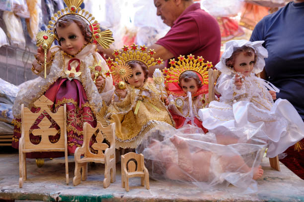 Oaxaca de Juarez, Mexican celebrations. Oaxaca, Mexico.  January 31, 2020. Baby Jesus dolls on sale before the February 2 Feast of Candelaria on display in window candlemas stock pictures, royalty-free photos & images