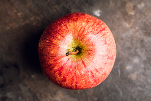 Close-up apples on the rustic wooden background. Selective focus. Shallow depth of field.