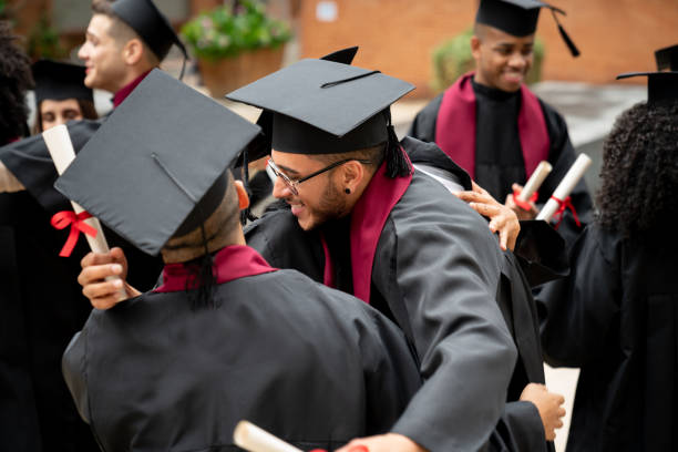 istock Group of students celebrating their graduation 1204089315