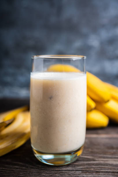 istock Banana milkshake with on the rustic background 1204090645