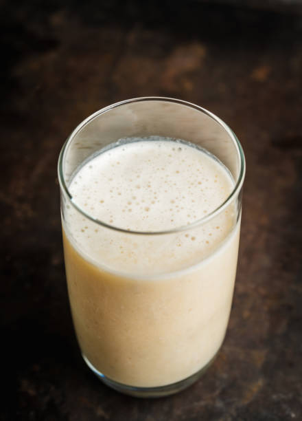 istock Banana milkshake with on the rustic background 1204090684