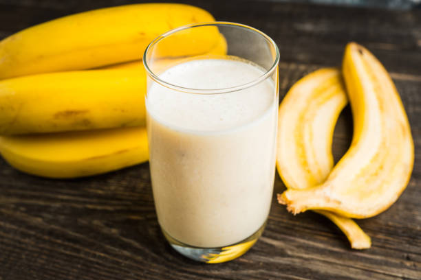 istock Banana milkshake with on the rustic background 1204091671
