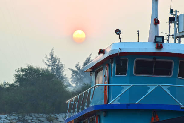 istock Fish boat and morning sun 1204091884