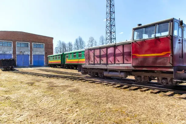 Narrow-gauge railway locomotive and carriage. Alapaevskaya narrow-gauge railway. Russia