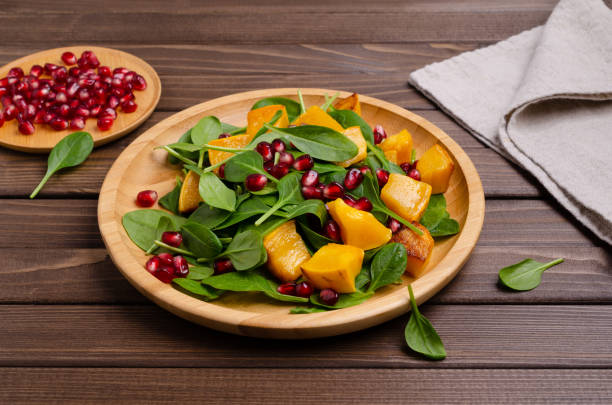 istock Spinach salad and baked pumpkin 1204092826