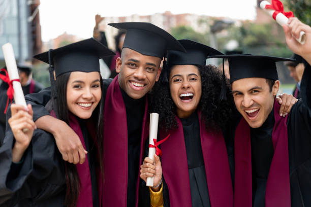 istock Group of students celebrating their graduation 1204093201