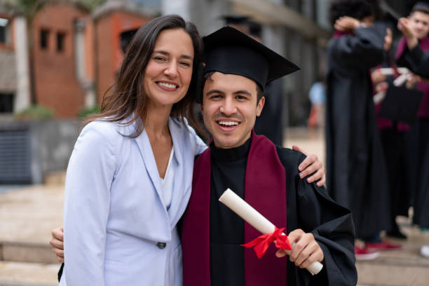 istock Graduate student looking very happy with his mother 1204093209