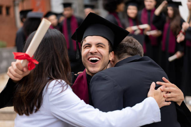istock Excited graduating student celebrating with his parents 1204093219