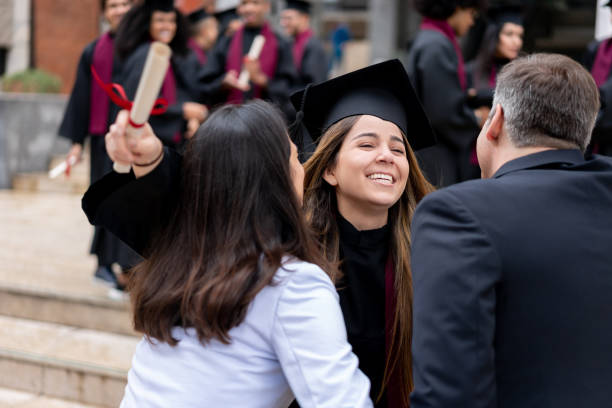 istock Excited graduating student celebrating with her parents 1204093227