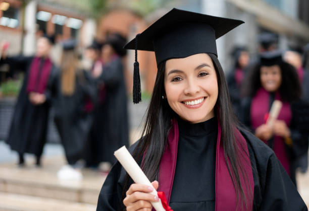 istock Happy graduating student holding her diploma 1204093255