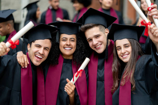 istock Happy group of students celebrating their graduation 1204093259